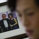 Gigi, her father (C) and brother Howard, seen in a family photograph in her office.